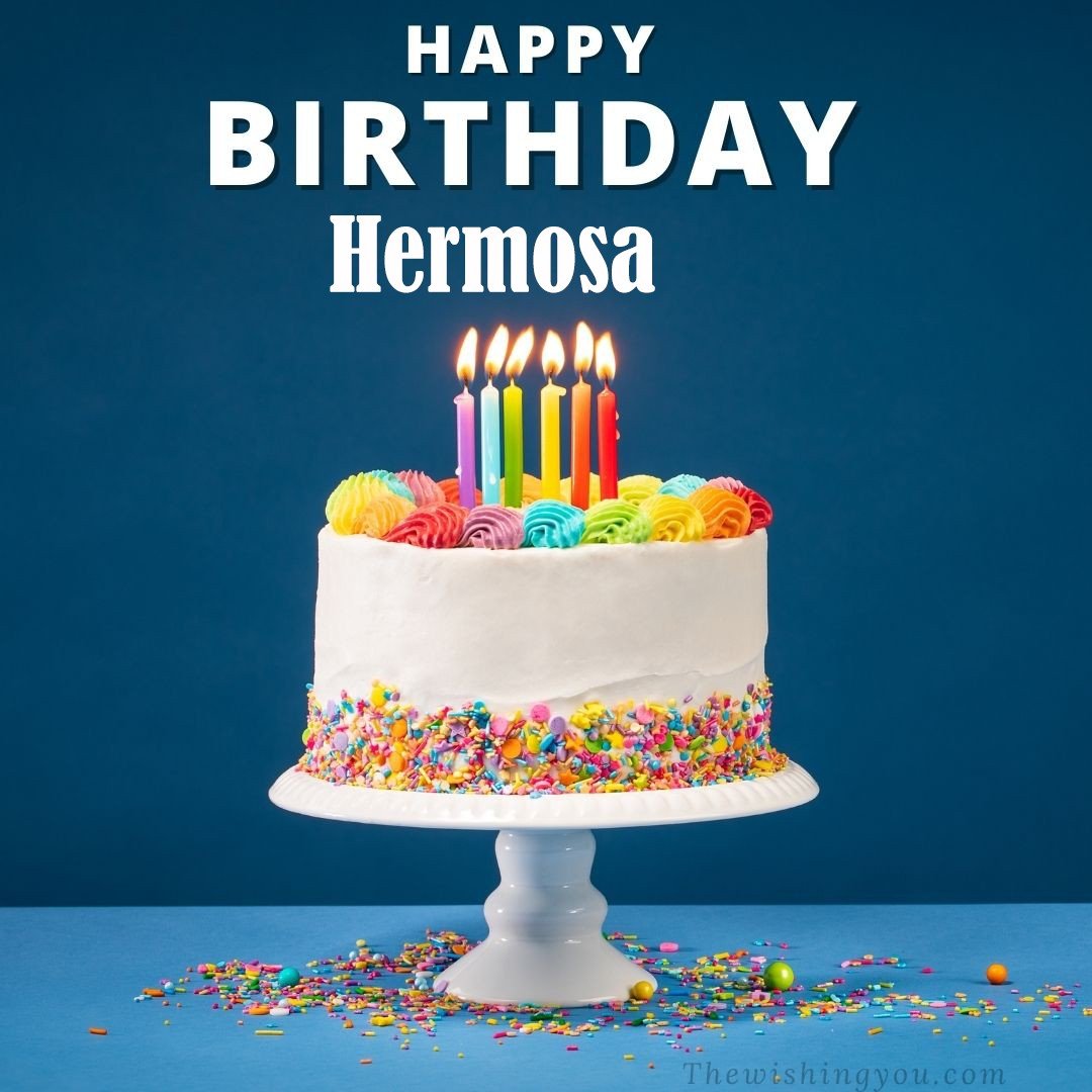 Happy birthday Hermosa written on image White cake keep on White stand and burning candles Sky background