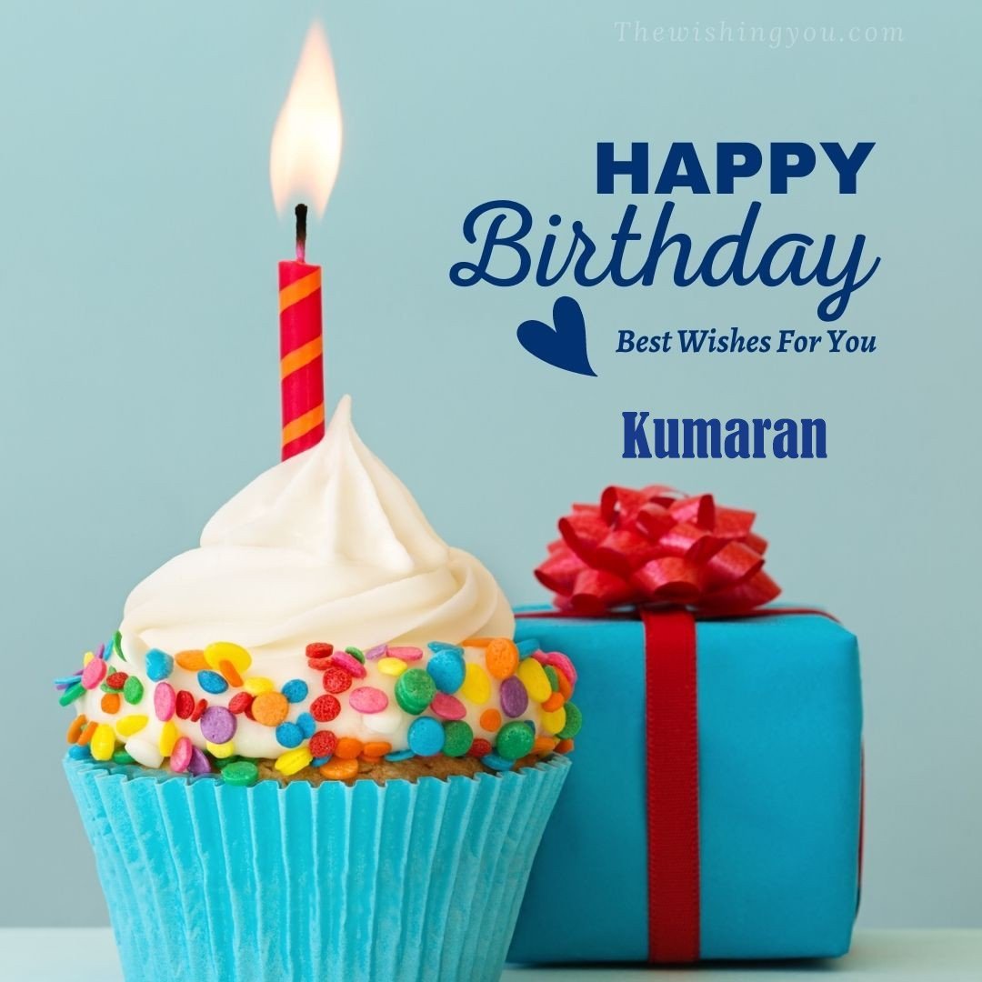 Happy Birthday Kumaran written on image Blue Cup cake and burning candle blue Gift boxes with red ribon