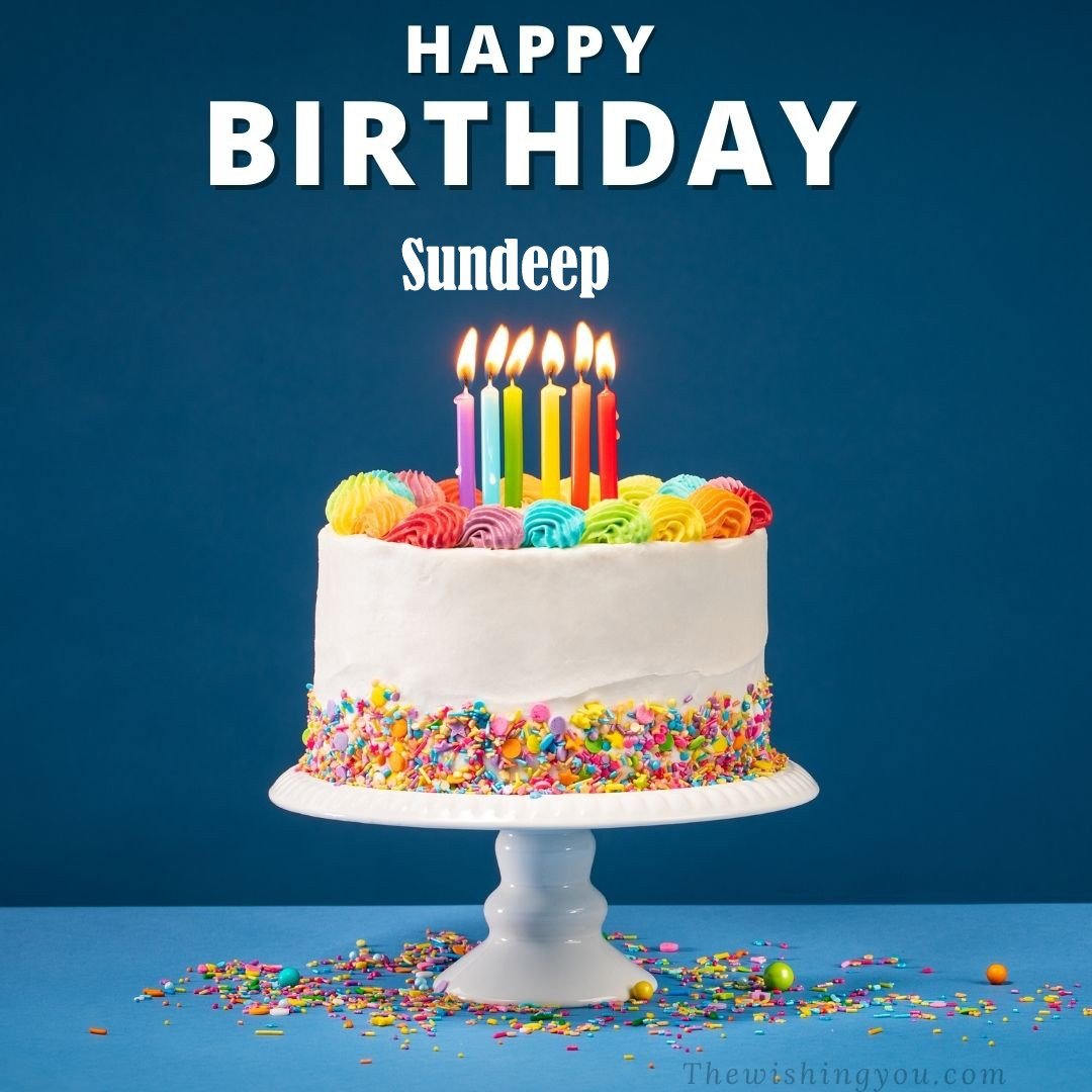 Happy Birthday Sundeep written on image White cake keep on White stand and burning candles Sky background