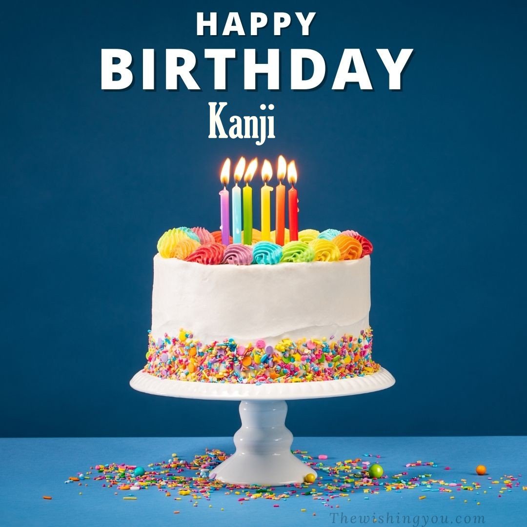 Happy birthday Kanji written on image White cake keep on White stand and burning candles Sky background