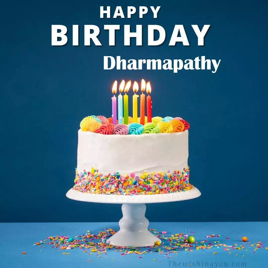 Happy Birthday Dharmapathy written on image, White cake keep on White stand and burning candles Sky background