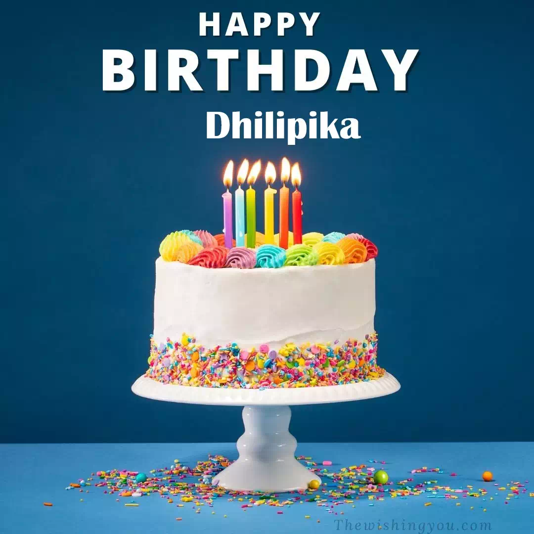 Happy Birthday Dhilipika written on image, White cake keep on White stand and burning candles Sky background